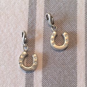 Set of Brighton horse shoe shaped charms.